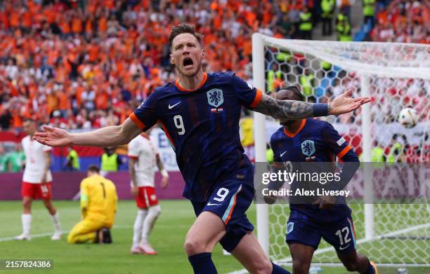 Wout Weghorst of the Netherlands celebrates scoring his team's second goal with teammates during the UEFA EURO 2024 group stage match between Poland...
