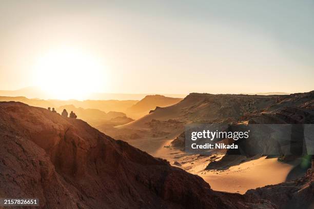 golden sunset over rugged atacama desert landscape - atacama desert stock pictures, royalty-free photos & images