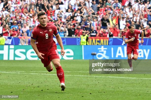 Serbia's forward Luka Jovic celebrates after scoring his team's first goal during the UEFA Euro 2024 Group C football match between Slovenia and...