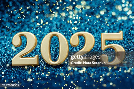 2025 New Year Celebration - Golden Numbers On Glitter blue background 2025 New Year Celebration - Golden Numbers On Glitter blue background