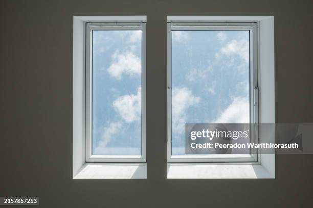 closed white tilt window skylights at attic - oberlicht stock-fotos und bilder