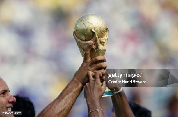 Brazil footballers celebrate with the FIFA World Cup trophy following the World Cup final between Brazil and Italy, at the Rose Bowl in Pasadena,...