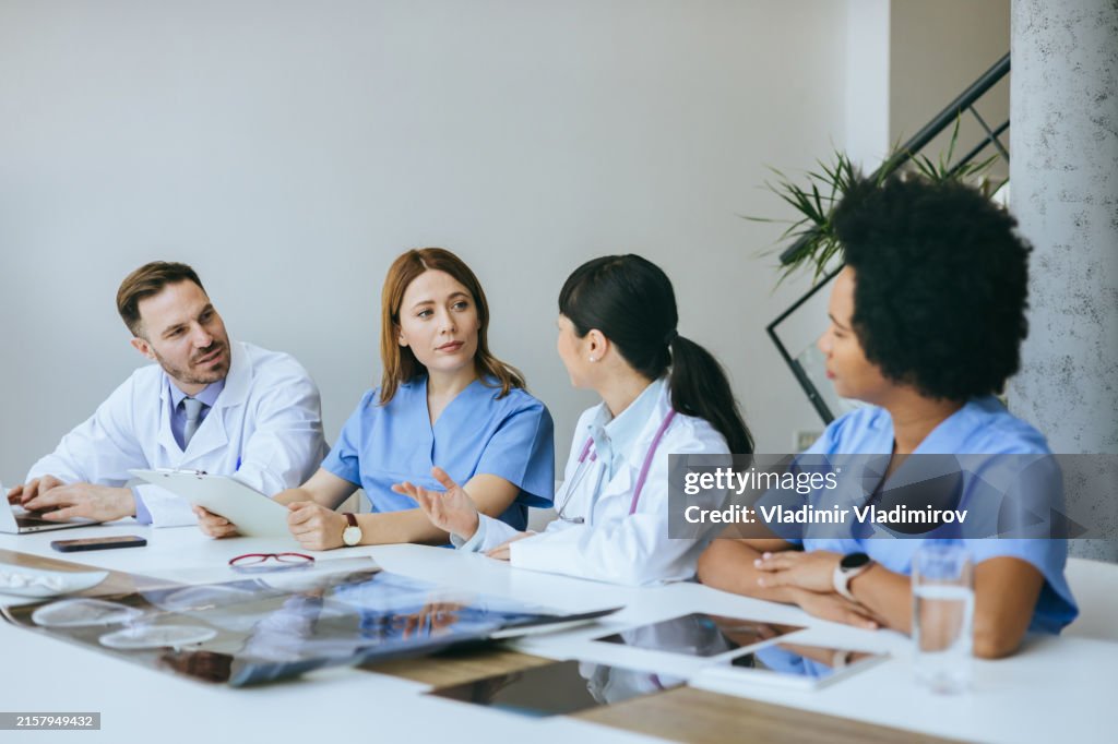Healthcare team discussing in meeting room