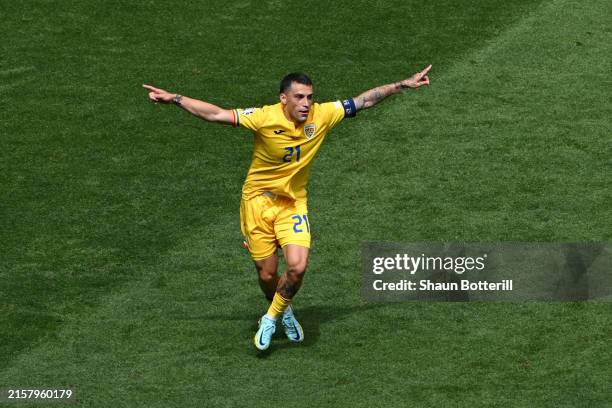 Nicolae Stanciu of Romania celebrates scoring his team's first goal during the UEFA EURO 2024 group stage match between Romania and Ukraine at Munich...