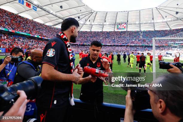 Mirlind Daku of Albania takes a megaphone and chants during the UEFA EURO 2024 group stage match between Croatia and Albania at Volksparkstadion on...
