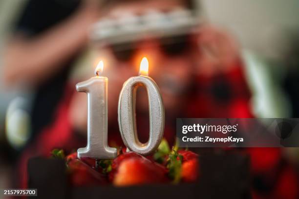 close up to number 10 candles on birthday cake. - 10 13 år bildbanksfoton och bilder