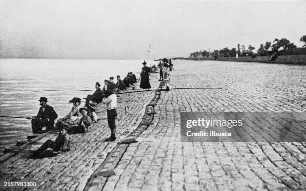 antique photograph of chicago: fishing, lincoln park - chicago beach stock illustrations