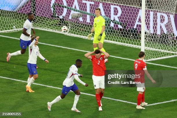 Maximilian Woeber of Austria reacts after conceding an own goal after deflecting a cross from Kylian Mbappe of France during the UEFA EURO 2024 group...