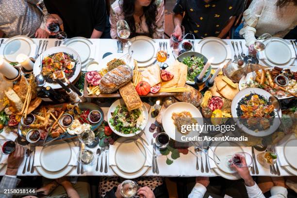 friends enjoy luxury meal at restaurant - several hands stock pictures, royalty-free photos & images