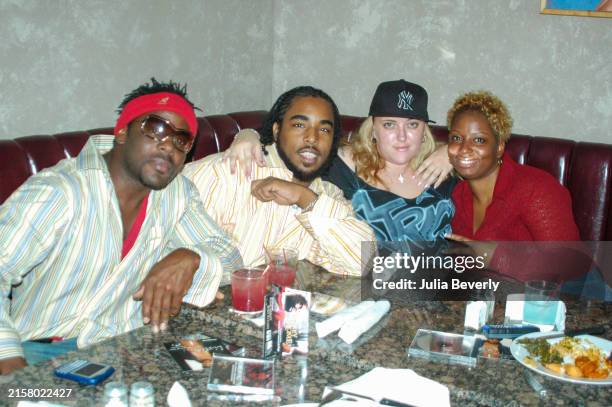 Magazine's Malik Abdul , Thomas "TJ" Chapman of TJ's DJ's, promoter Mercedes Streets , and publicist Christina Clark in August 2004 in Chicago,...