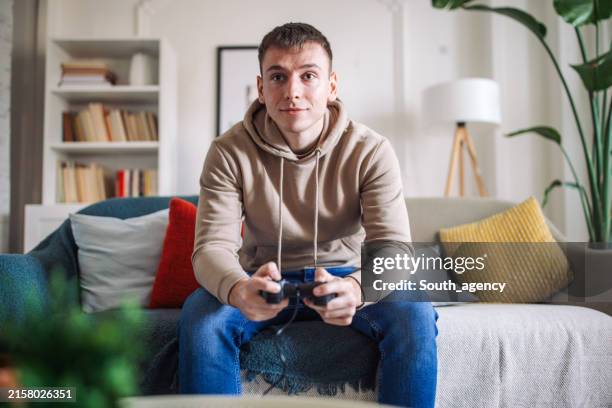 intense gaming session at home - man gaming on computer stock pictures, royalty-free photos & images