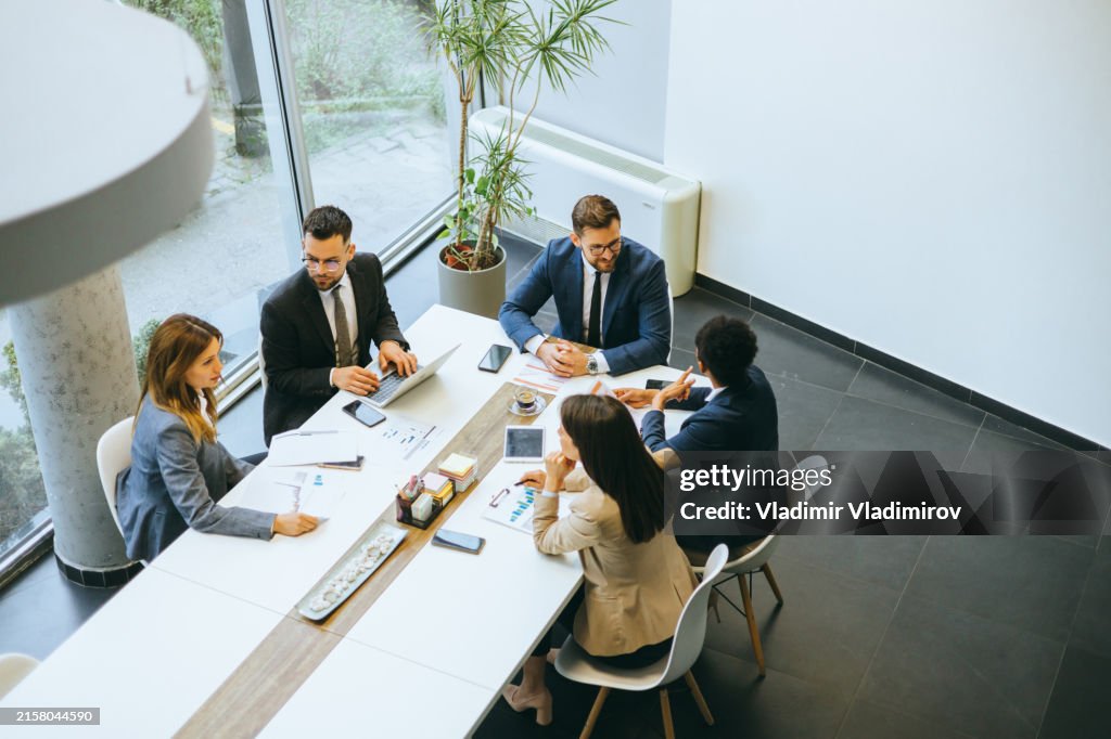 Corporate team in discussion at modern office