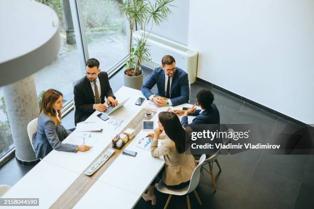 corporate team in discussion at modern office - business talk stock pictures, royalty-free photos & images
