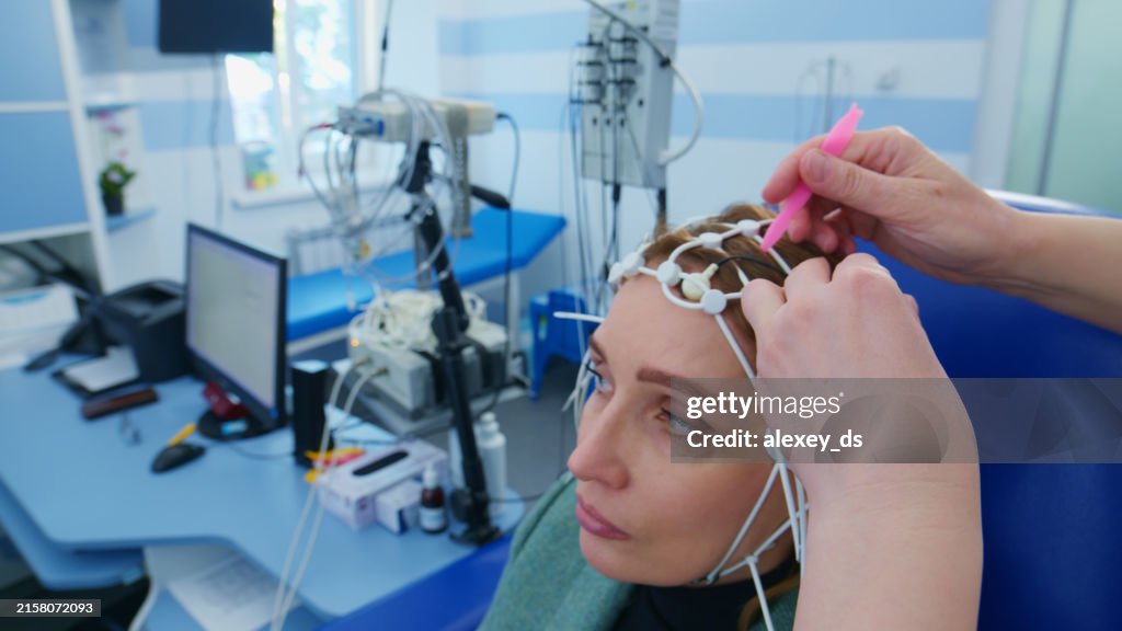 Woman Undergoing EEG Test in Medical Clinic