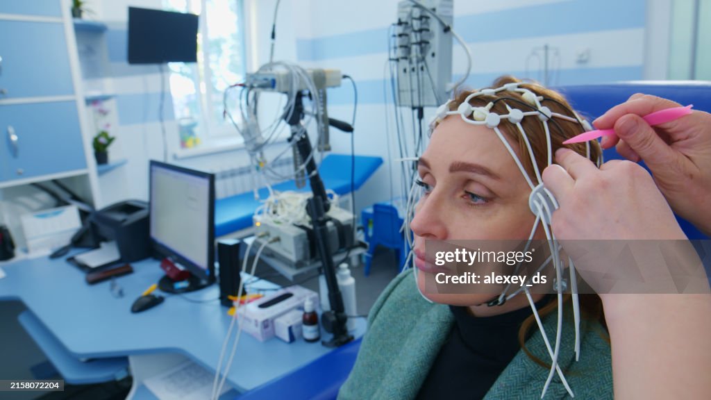 Female patient Undergoing EEG Test in Medical Clinic