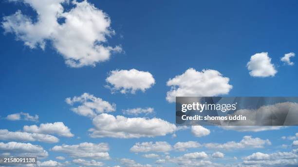 white fluffy clouds sky - clouds in blue sky stock pictures, royalty-free photos & images