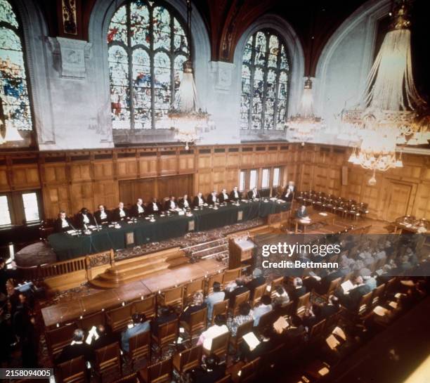 The International Court of Justice in The Hague pictured during a public sitting, February 18th 1976. Left to right: Registrar Stanislas Aquarone;...