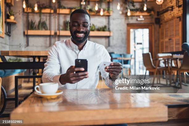 modern businessman shopping online using mobile phone - online bank statement stock pictures, royalty-free photos & images