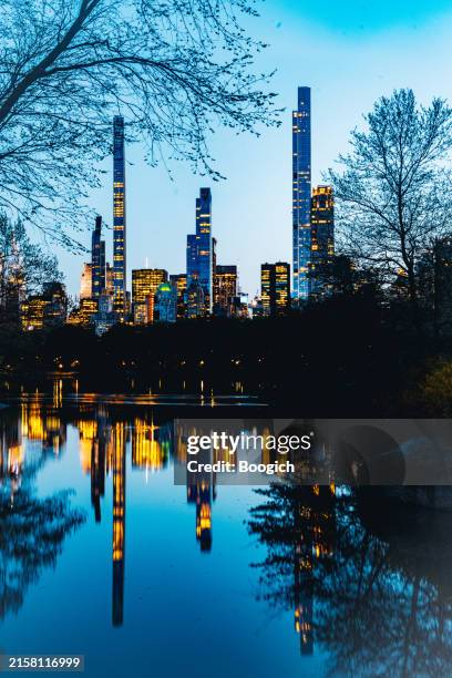 nyc skyline view at dusk in central park - moody sky stock pictures, royalty-free photos & images