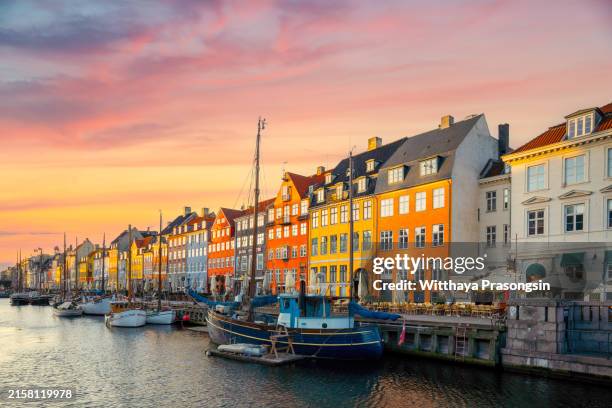copenhagen, denmark on the nyhavn canal. - copenhagen nyhavn stock pictures, royalty-free photos & images