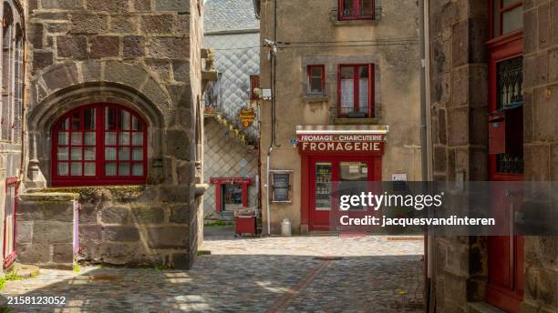 street in the medieval village of besse-et-saint-anastaise, auvergne, france - auvergne stock pictures, royalty-free photos & images