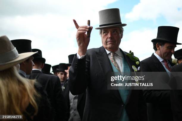 Racegoer gestures inside the royal enclosure on the fifth day of the Royal Ascot horse racing meeting in Ascot, west of London, on June 22, 2024.