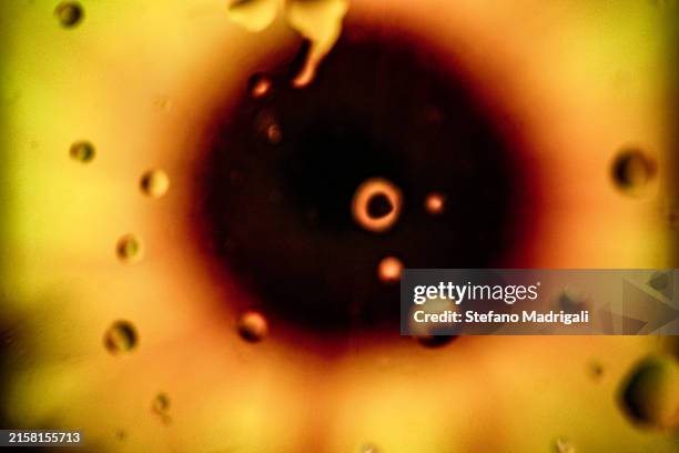 water drops with abstract yellow background - italia vignette stock pictures, royalty-free photos & images