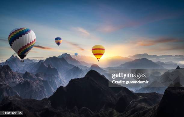 hot air balloons flying over rocky mountains in turkey - luftballong bildbanksfoton och bilder