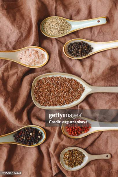 spices herbs seasoning condiments on vintage spoons - condiment stock pictures, royalty-free photos & images