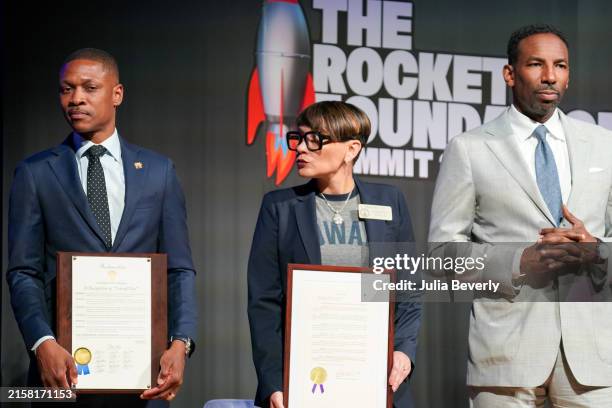 Atlanta City Council member Jason Winston, Georgia State Representative Inga Willis, and Atlanta Mayor Andre Dickens present Takeoff's family with a...