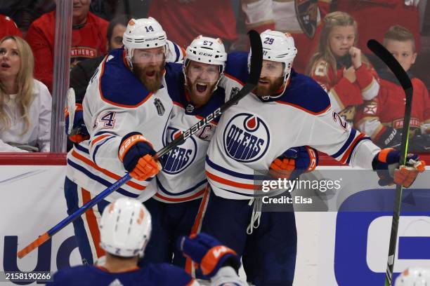 Connor McDavid of the Edmonton Oilers celebrates with teammates after scoring during the third period against the Florida Panthers in Game Five of...