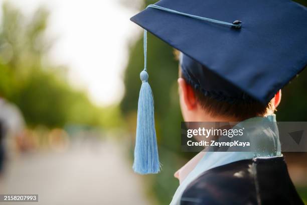 close up to graduation cap tassel. - graduation gown stock pictures, royalty-free photos & images