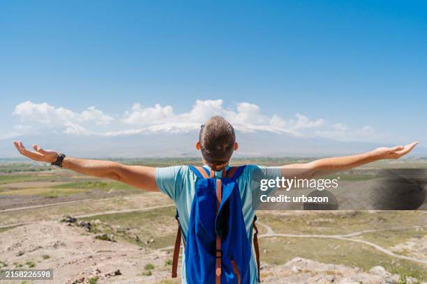 mid-adult man enjoying the view from the mount ararat in armenia - mt ararat stock pictures, royalty-free photos & images