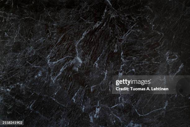 close-up of dark gray, almost black, smooth and natural textured marble pattern background. - marbles stock pictures, royalty-free photos & images