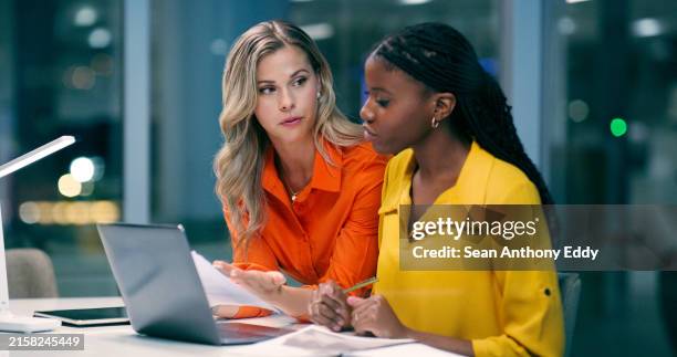 team diversity, overtime and women in office with documents, talking and discussion at night. teamwork, late work and female partners in boardroom for strategy, corporate project and technology - deadline stock pictures, royalty-free photos & images