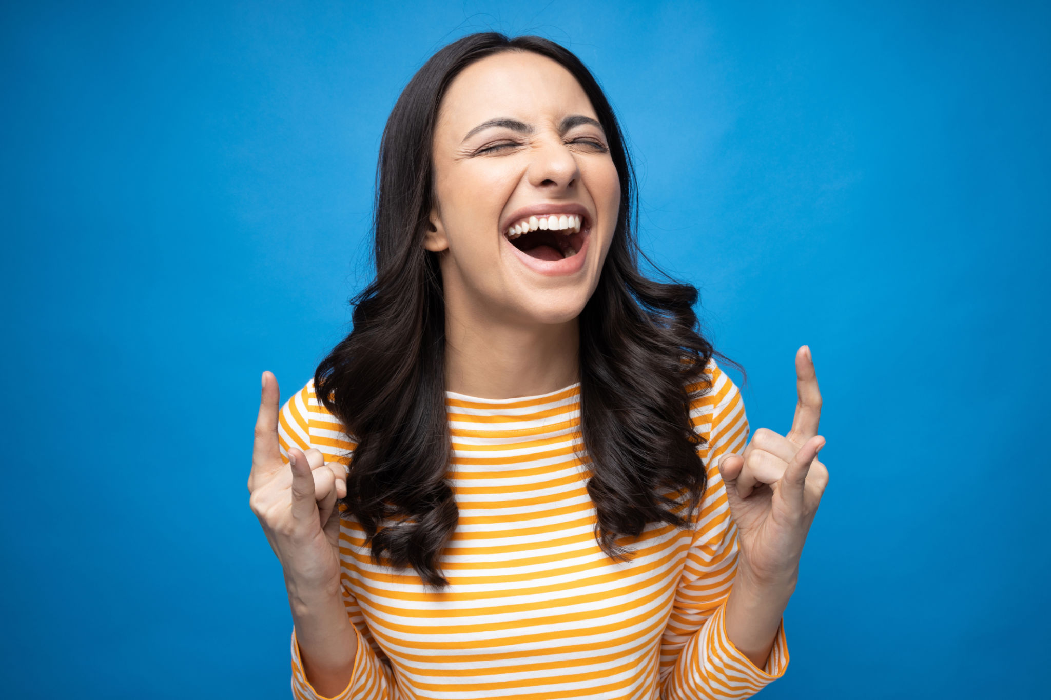 Portrait of young woman wear trendy smart casual outfit isolated on blue background stock photo Portrait of young woman wear trendy smart casual outfit isolated on blue background stock photo