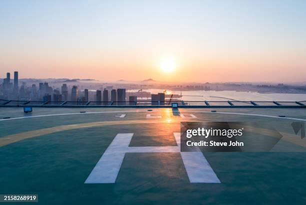seascape and city under helicopter platform - helipad stock pictures, royalty-free photos & images