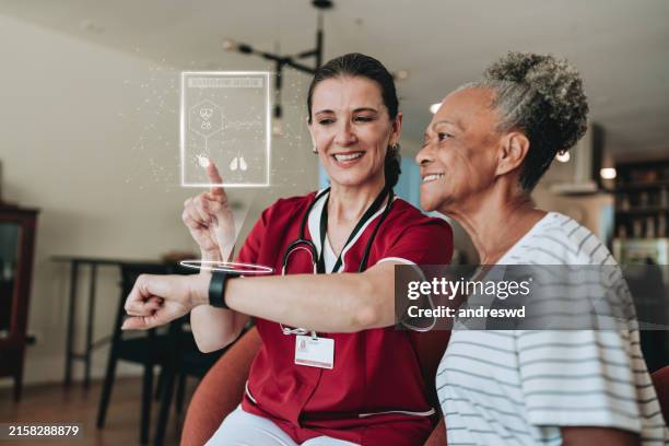 home medical care using artificial intelligence using smartwatch - social services stock pictures, royalty-free photos & images
