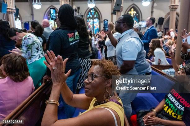 New Jersey residents, many of whom have loved ones currently or formally in prison, watch as New Jersey Governor Phil Murphy signs an executive order...