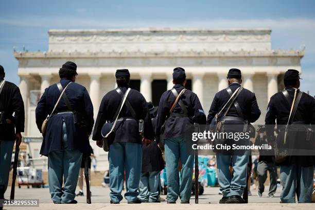 Members of the U.S. Colored Troops and Buffalo Soldiers, an organization of living historians and re-enactors from Maryland, Georgia, Massachusetts...