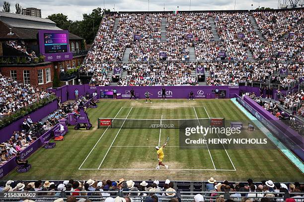 Italy's Lorenzo Musetti returns against US player Tommy Paul during their men's singles final tennis match on the last day of the Cinch ATP tennis...