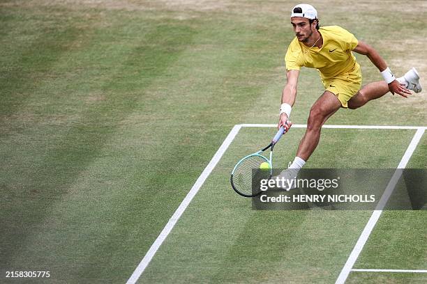 Italy's Lorenzo Musetti returns against US player Tommy Paul during their men's singles final tennis match on the last day of the Cinch ATP tennis...