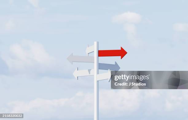 direction sign with a sky background - señal de dirección fotografías e imágenes de stock