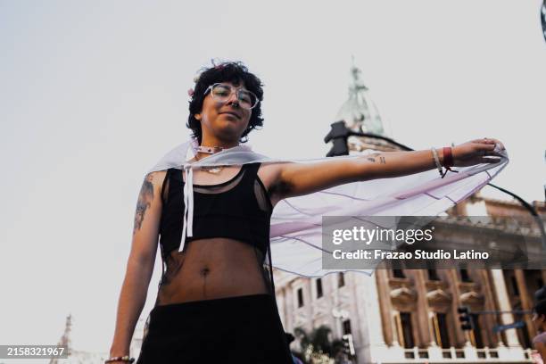 portrait of young man at lgbtqia pride parade - protest stock pictures, royalty-free photos & images