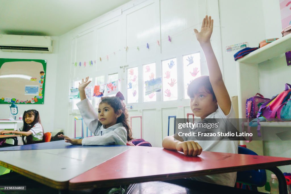 Questions Class Pic Children Asking Questions During Class At School High-Res Stock Photo ...