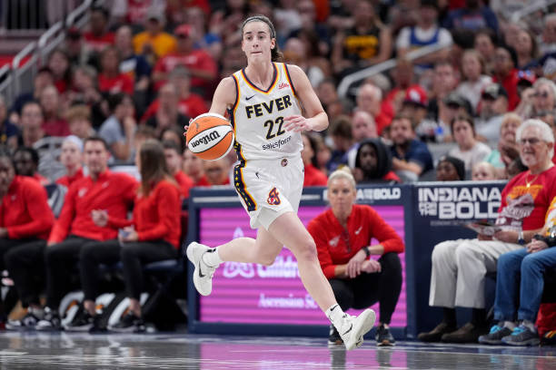 Caitlin Clark of the Indiana Fever brings the ball up court during the first half of a game against the Washington Mystics at Gainbridge Fieldhouse...