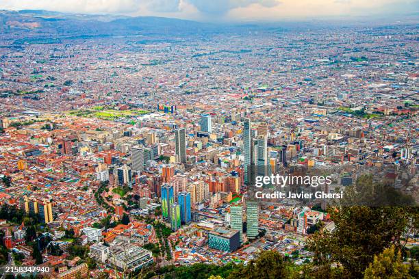 bogota, colombia. panoramic view of the city from cerro de monserrate on a cloudy day. - bogota stock pictures, royalty-free photos & images