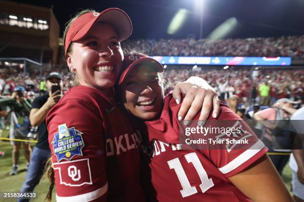 Kasidi Pickering and Kierston Deal of the Oklahoma Sooners celebrate after defeating Texas Longhorns in game two of the Division I Softball...