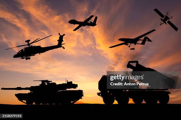 armored tanks, combat drone and missile launcher at sunset. modern us military equipment - exercício militar imagens e fotografias de stock