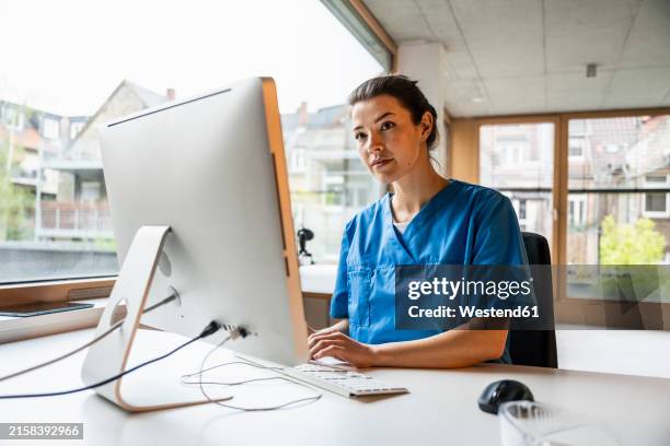Nurse Ringing Computer 661 Nurse At Computer Clinic Stock Photos, High-Res Pictures, and ...